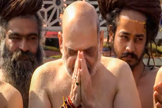 In this screenshot from a video provided by CMO, Union Home Minister Amit Shah takes a holy dip during Mahakumbh, at Sangam in Prayagraj, Monday, Jan. 27, 2025.