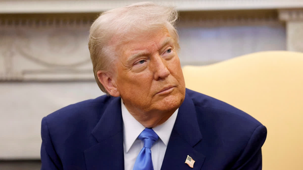 President Donald Trump listens during a meeting with France's President Emmanuel Macron in the Oval Office of the White House in Washington, Monday, Feb. 24, 2025.