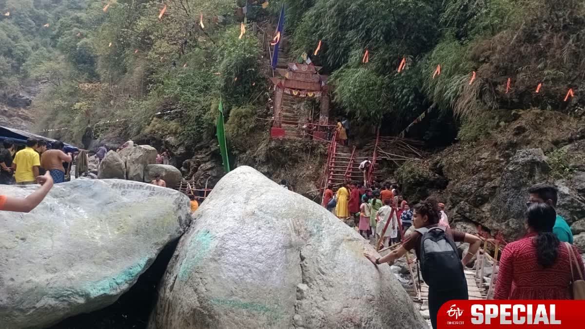 Devotees climb steep steps on the hilly path to Jayanti Bara Mahakal Dham.