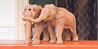 A statue depicting a heart touching emotional moment between two elephants in Thrissur