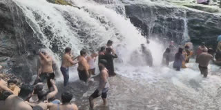 Tourists at kumbakarai waterfalls image