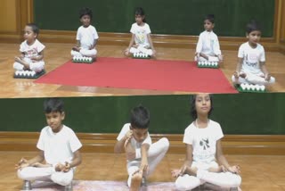 School students sitting in yoga position Image