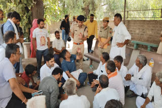 Police discussing with the family members