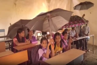 The continuous downpour in the NTR district of Andhra Pradesh has led the students of Vissannapet Zilla Parishad High School of Vissannapet village to hold umbrellas to avoid themselves from getting wet after water seeped into the classrooms through broken roof sheets