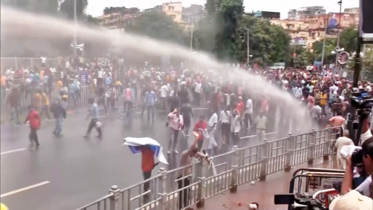 Kolkata police use water cannons to stop protesters marching towards state secretariat on Tuesday.