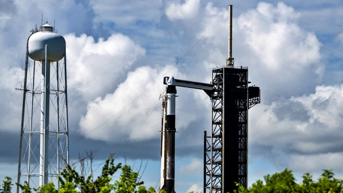 A SpaceX Falcon 9 rocket with the Crew Dragon Resilience capsule sits on Launch Complex 39A at Kennedy Space Center ahead of the Polaris Dawn Mission due to launch on August 27 at the Kennedy Space Center in Florida, on August 26, 2024. The mission crew will carry out the first ever private spacewalk.