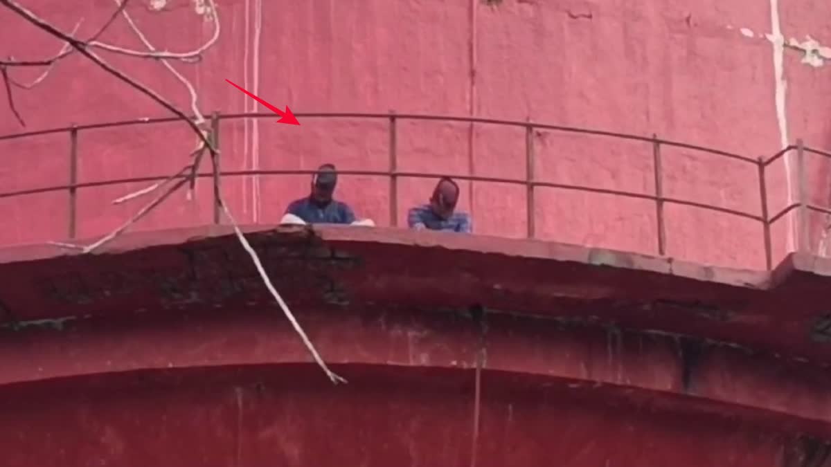 students climbed on tank to demand