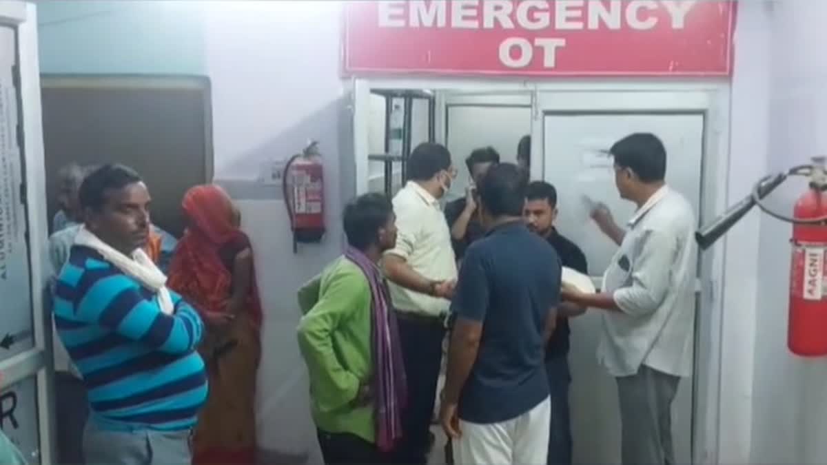 Family members of a wild animal attack victim wait outside the emergency of a hospital in Uttar Pradesh's Bahraich