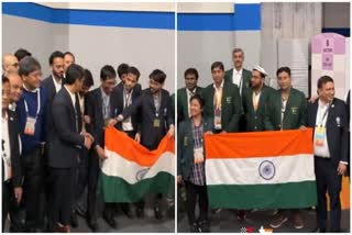 Pakistan chess team poses with India flag