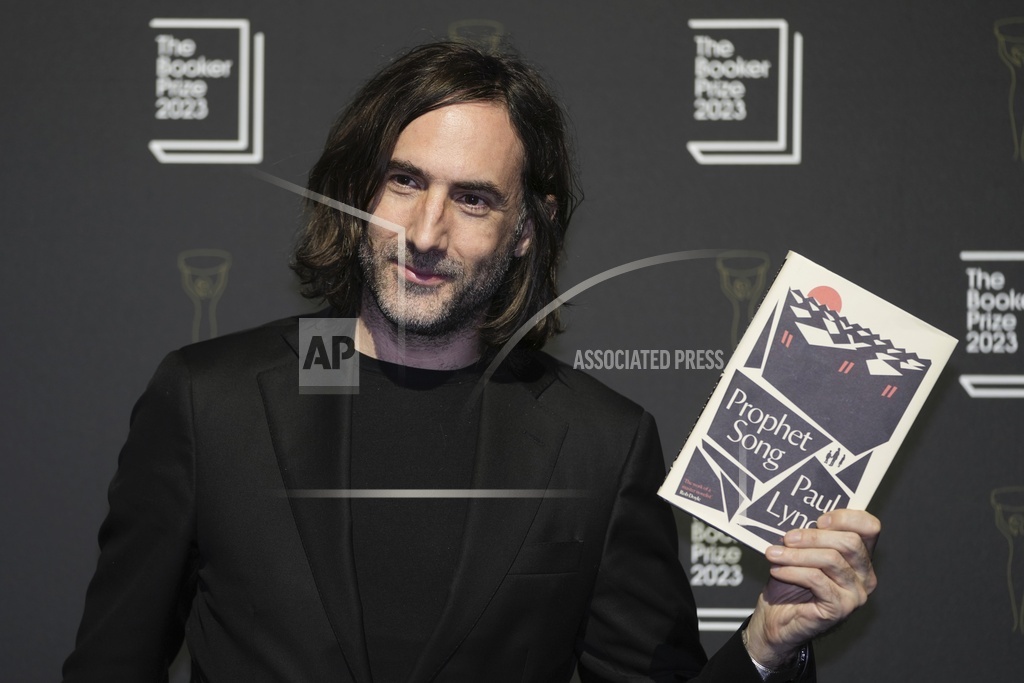 Irish author Paul Lynch poses with his book 