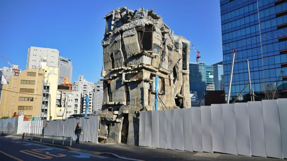 Passers-by stop and stare at the ramshackle, hand-built concrete tower that looks like it has been lifted right out of a Japanese animation and dropped onto a real-life Tokyo street.