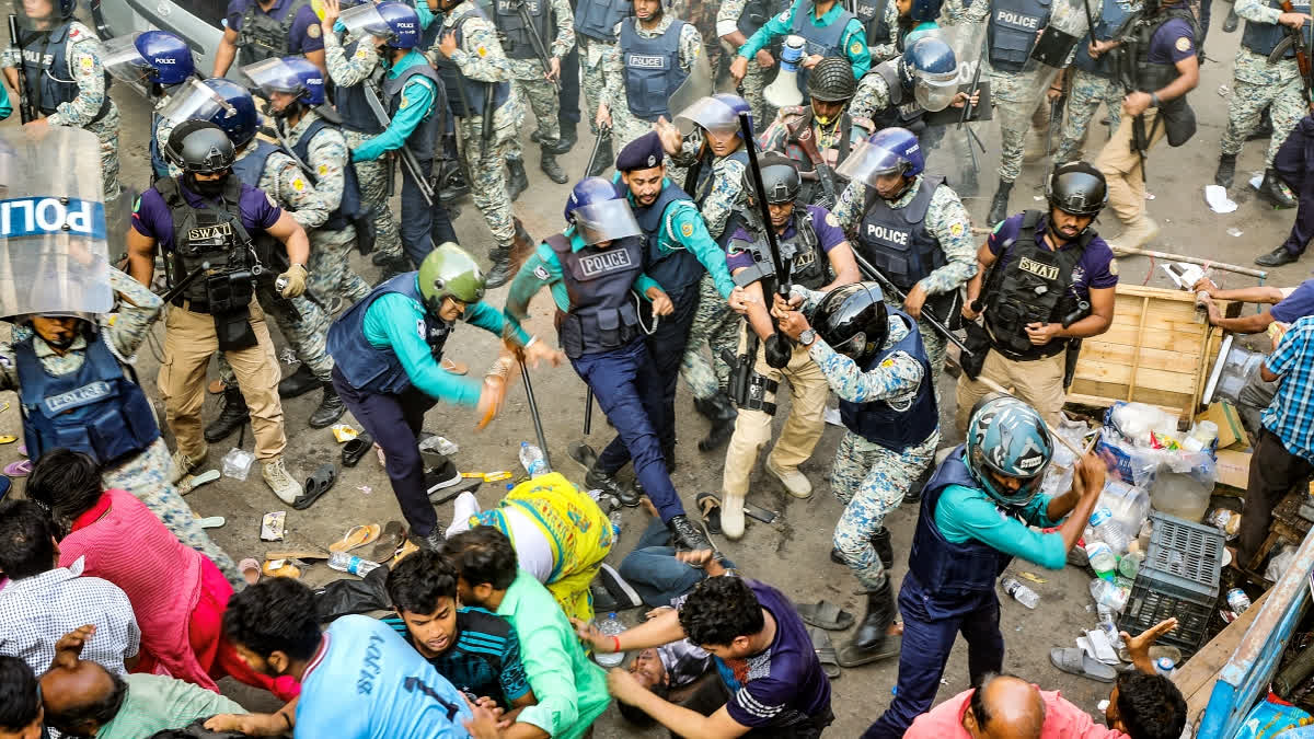 Police personnel baton-charge protesting supporters of Chinmoy Krishna Das Brahmachari, a jailed Hindu monk leader, member of the Bangladesh Sammilito Sanatan Jagaran Jote group and former member of ISKCON, during a demonstration after court denied his bail in Chittagong on November 26, 2024.