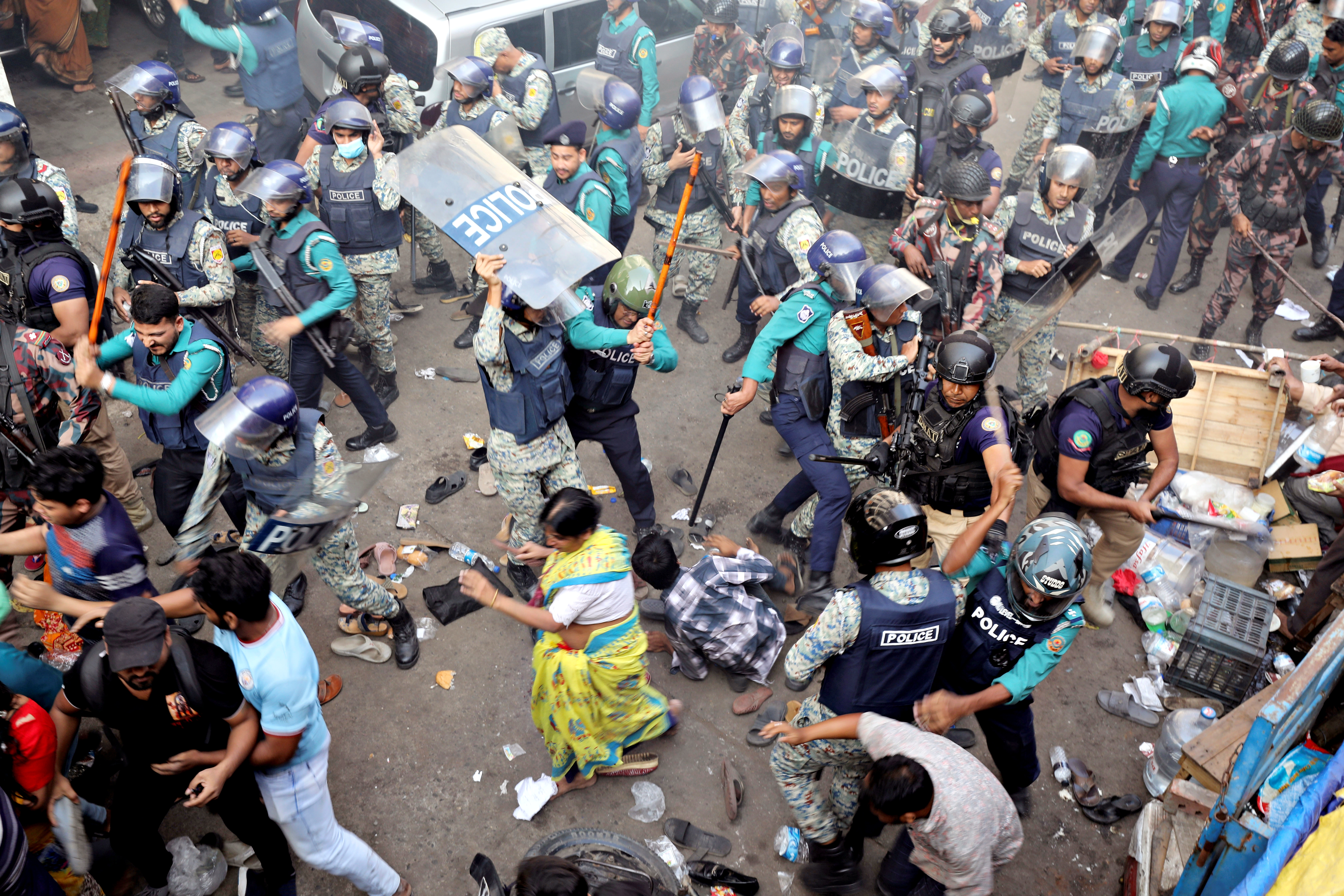 Policemen charge baton to disperse the supporters of Bangladeshi Hindu leader Krishna Das Prabhu after they surrounded police van carrying their leader at the court premises, in Chattogram in southeastern Bangladesh, Tuesday, Nov. 26, 2024