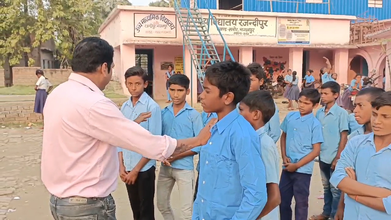 Bihar Teacher Amit Ranjan (L) during school hours