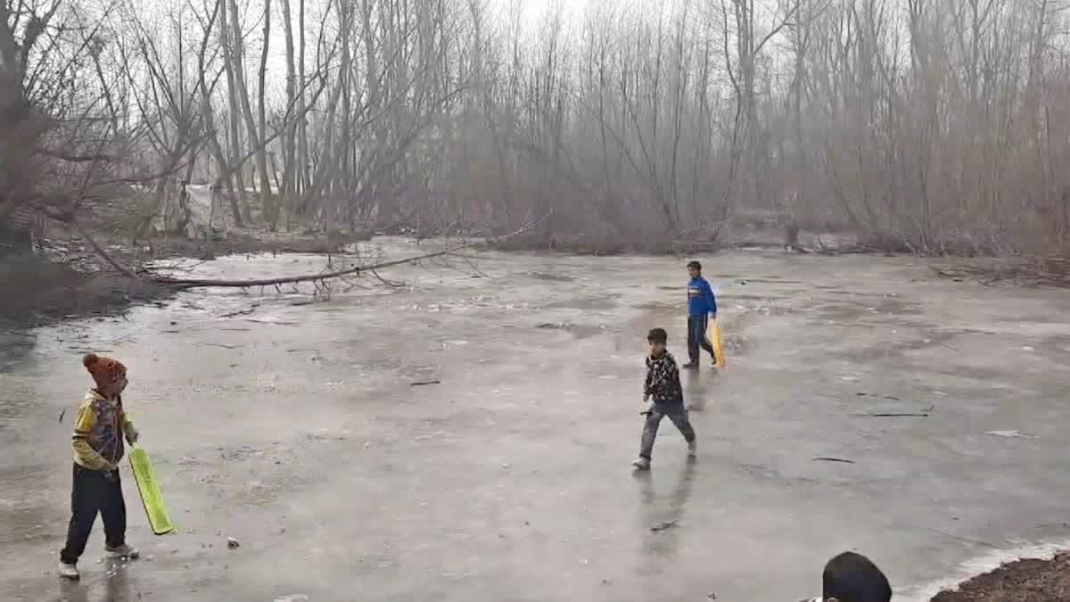 Kids playing cricket in a frozen pond