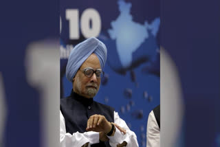 In this Nov. 1, 2010 file image, Prime Minister Manmohan Singh looks at his watch during the inaugural ceremony of 'Petro-Tech 2010 conference' at Vigyan Bhawan in New Delhi. Singh passed away on Thursday, Dec. 26, 2024 at AIIMS Delhi. He was 92.