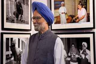 In this Tuesday, Nov. 6, 2018 file image, former prime minister Manmohan Singh visits the photo exhibition '200 & One' by Photojournalist Praveen Jain, in New Delhi.