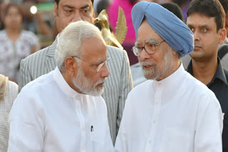 In this Sept. 30, 2017 file image, Prime Minister Narendra Modi talks with former prime minister Manmohan Singh during Dussehra celebrations at Parade Ground in New Delhi.