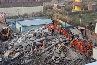 Rescue work underway after a four-storey building collapsed, at Burari area, in New Delhi, Tuesday, Jan. 28, 2025.