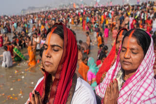 Devotees take a holy dip at the Sangam on the eve of 'Mauni Amavasya' during the Maha Kumbh Mela 2025, in Prayagraj, Uttar Pradesh, Tuesday, Jan. 28, 2025.