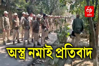 Police and police commando forces protest by surrendering weapons