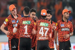 Sunrisers Hyderabad's captain Pat Cummins, left, greets teammates after winning the match against Mumbai Indians in the Indian Premier League cricket tournament in Hyderabad, India, Wednesday, March 27, 2024.