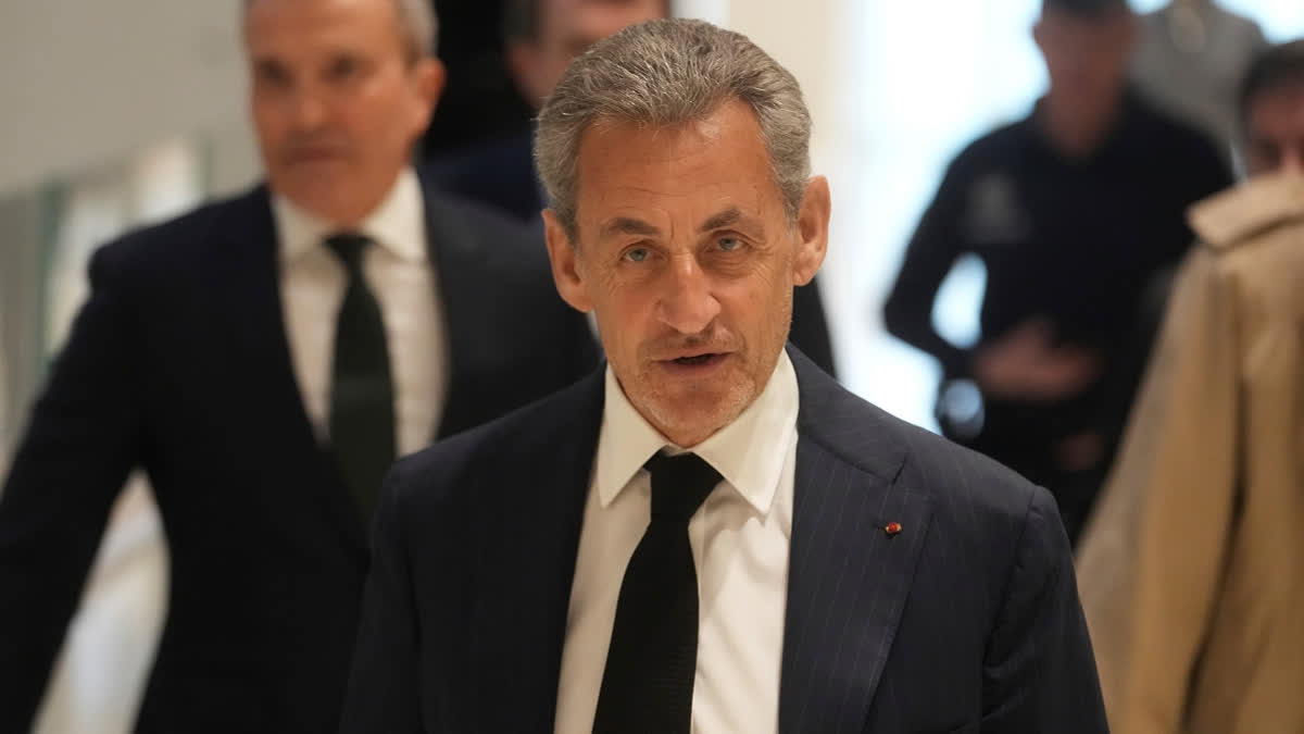 FILE - Former French President Nicolas Sarkozy arrives as he goes on trial over alleged illegal financing of his 2007 presidential campaign by the government of late Libyan leader Moammar Gadhafi, Monday, Jan. 6, 2025 in Paris.