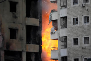 Flames rise between two buildings after an Israeli airstrike on Dahiyeh in the southern suburb of Beirut, Lebanon, Sunday, April 27, 2025.