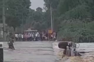 TRACTOR WASHED AWAY IN RIVER