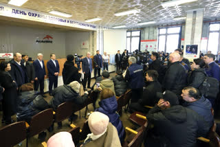 In this photo released by Kazakhstan's Presidential Press Office, Kazakh President Kassym-Jomart Tokayev, center left, expresses condolences to the families and friends of the miners who died in the fire in Karaganda, Kazakhstan, Saturday, Oct. 28, 2023. A coal mine fire in central Kazakhstan has killed at least 21 workers while another 25 remained unaccounted for, the operating company ArcelorMittal Temirtau said in a statement. ArcelorMittal Temirtau is the local representative for Luxembourg-based multinational ArcelorMittal, the world's second-largest steel producer. (Kazakhstan's Presidential Press Office via AP)