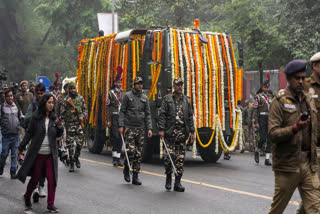 The mortal remains of former prime minister Manmohan Singh being taken to Congress headquarters for party leaders and workers to pay their last respects to him, in New Delhi, Saturday, Dec. 28, 2024.