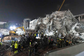 Rescuers search for victims at the site of a high-rise building under construction that collapsed after a strong earthquake in Bangkok, Thailand, early Saturday, March 29, 2025.