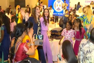 MISS WORLD CONTESTANTS WITH ORPHANS