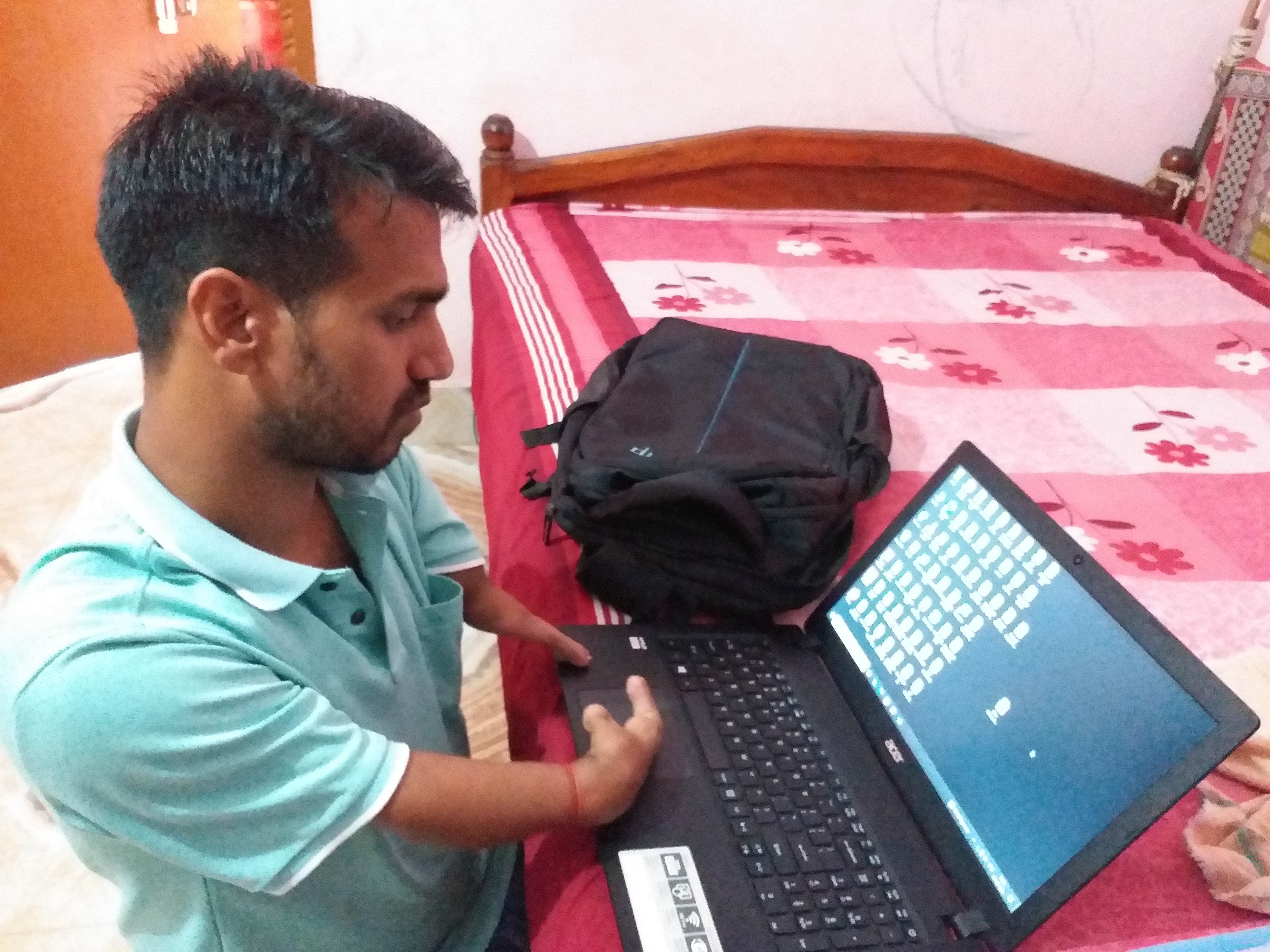 Physically Challenged Gyana Das Operating Laptop
