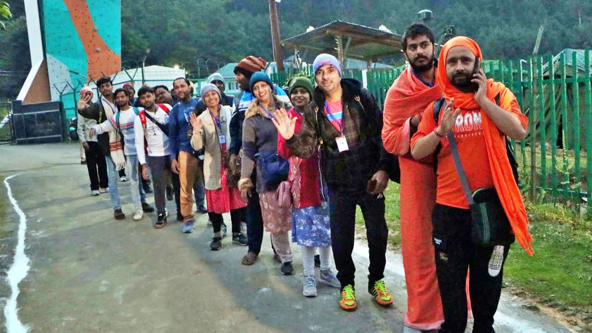 Pilgrims from the first batch of the Amarnath Yatra stand in a queue at Nunwan base camp prior to leaving for the cave shrine on the first day of the yatra, in Pahalgam on Saturday.