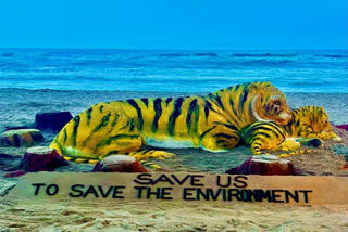 Sand Artist Sudarsan Pattnaik created a 15-foot-tall stunning sand sculpture on the Puri beach to commemorate International Tiger Day