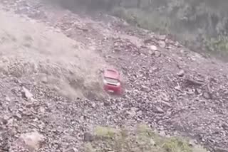 A car washed away with mud