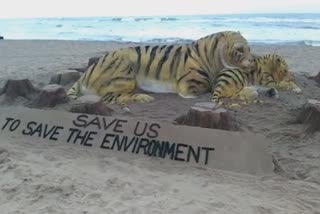 Sand artist Sudarsan Pattnaik created a 15-foot tall tiger on the occasion of  International tiger day