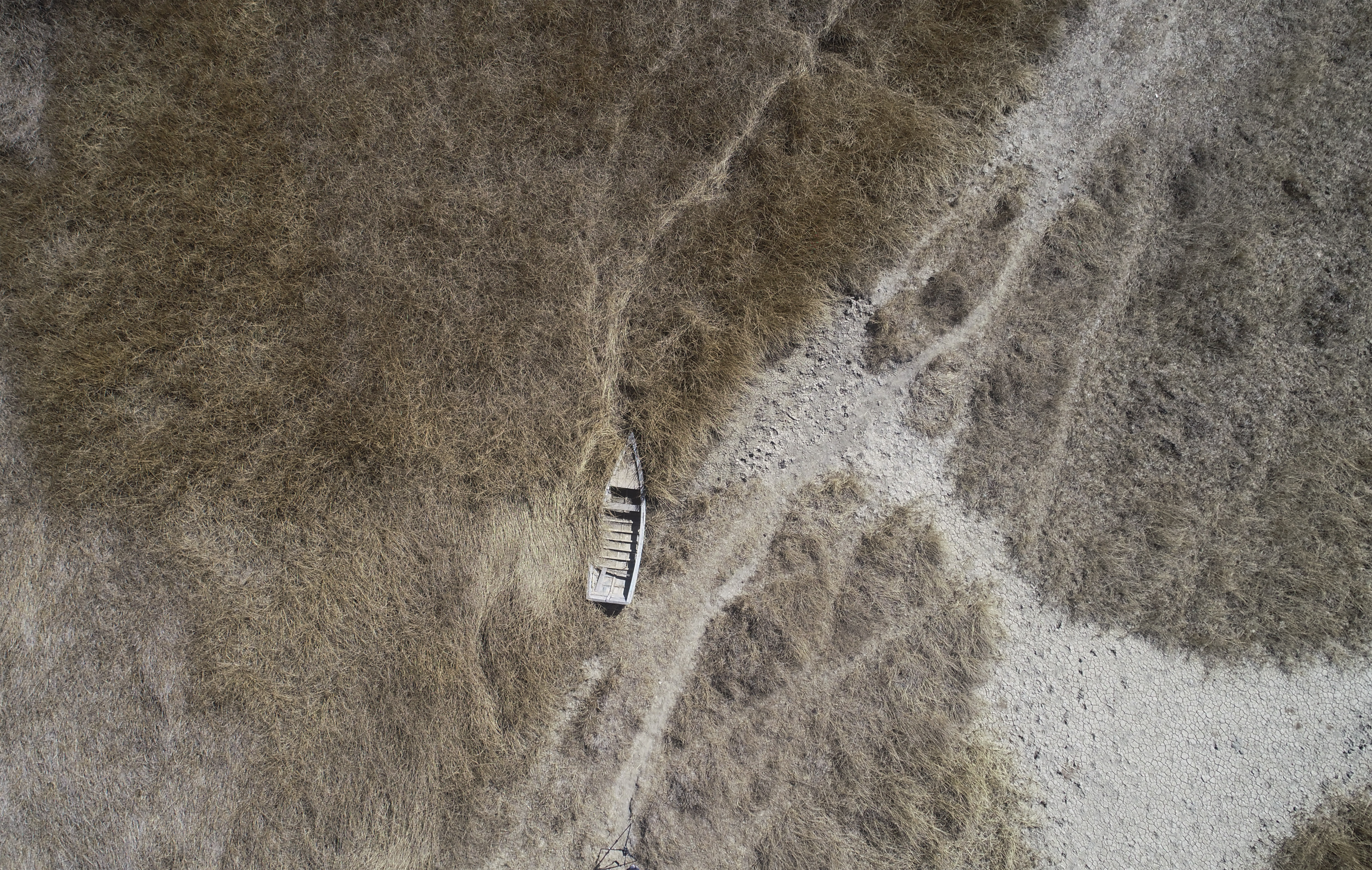 The lake's low water level is having a direct impact on the local flora and fauna and is affecting local communities that rely on the natural border between Peru and Bolivia for their livelihood.