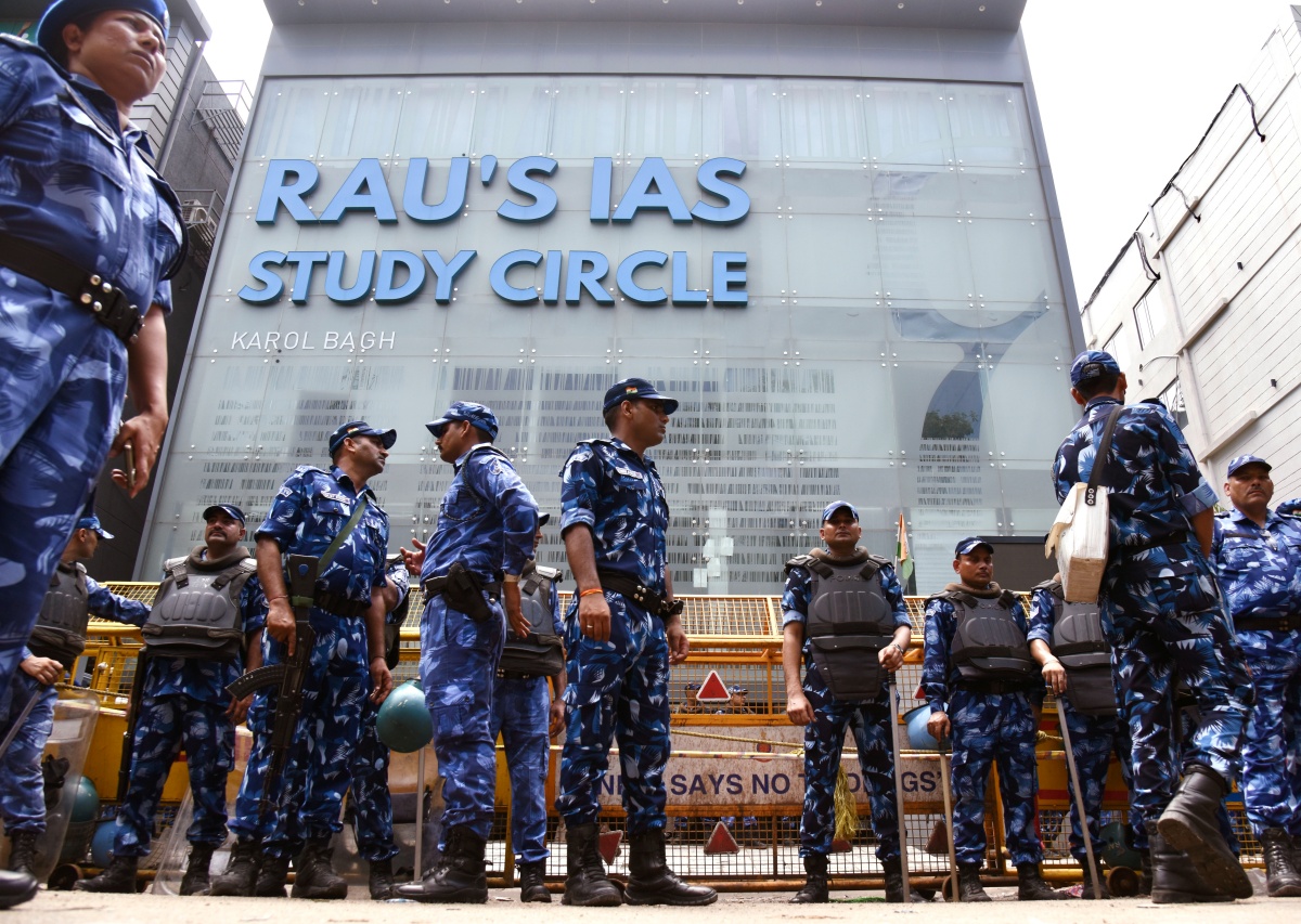 RAF stand guard outside the 'Rao IAS Study Centre' after 3 civil service aspirants died due to flooding in the basement of the coaching centre, at Old Rajinder Nagar in New Delhi on Sunday.