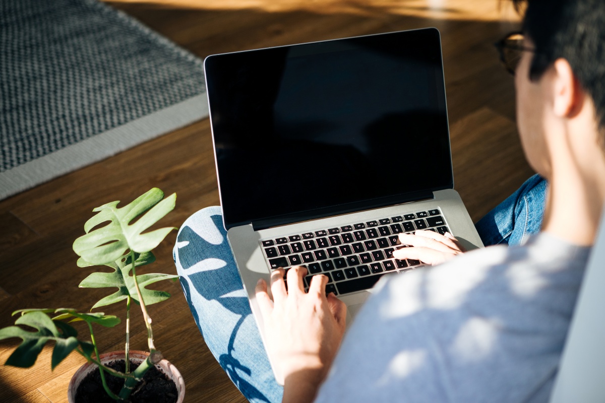 Man working on his laptop at home