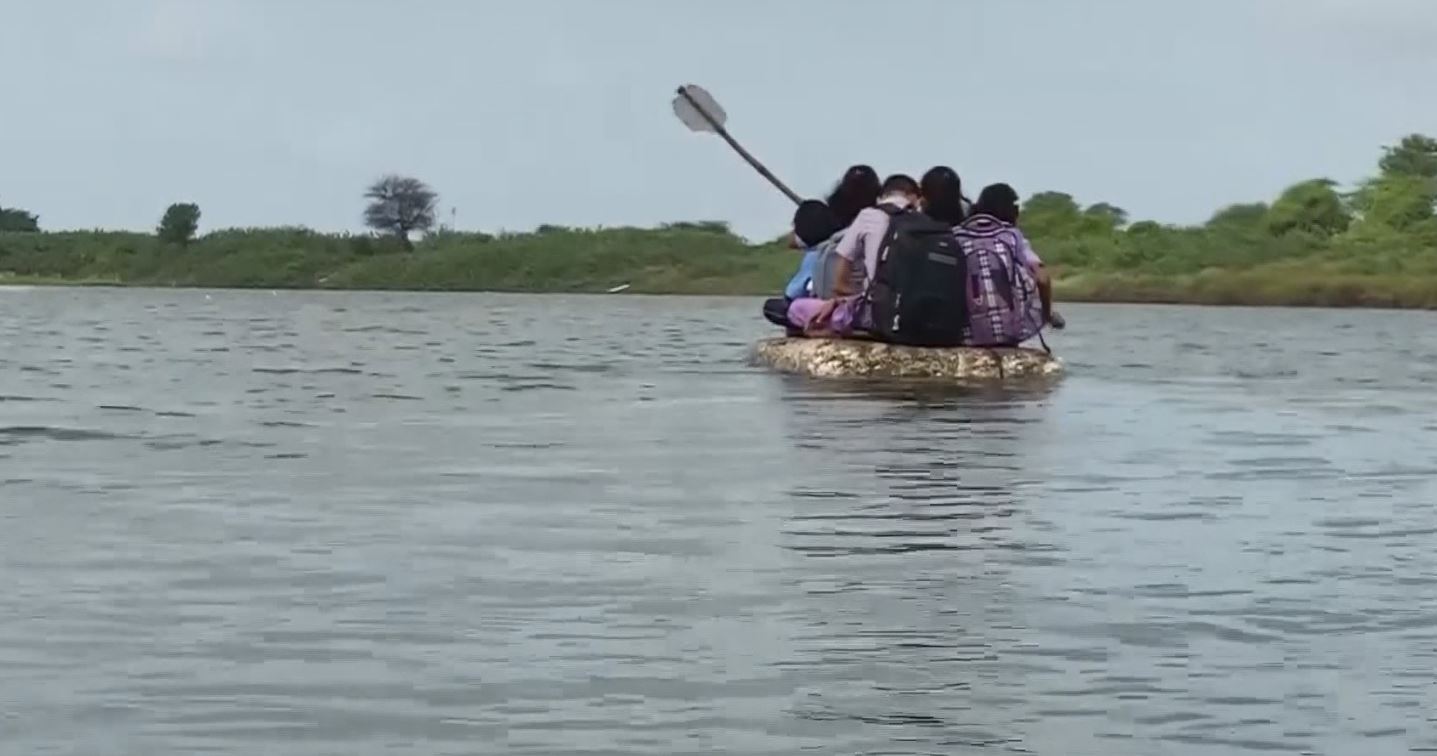 Students Crossing The River By Rowing Thermocol Raft