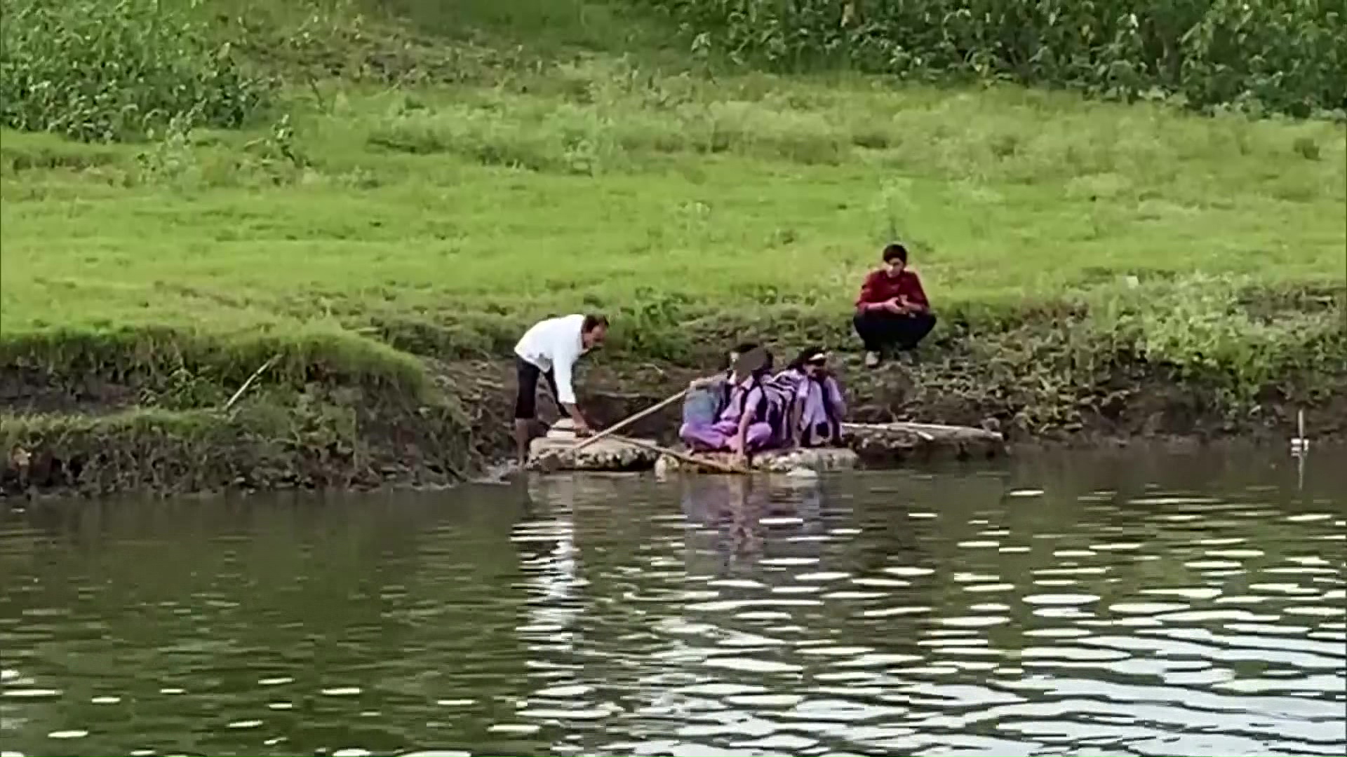 Students Crossing The River By Rowing Thermocol Raft