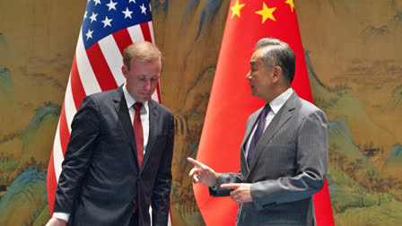 Wang Yi, right, the director of the Communist Party's Central Foreign Affairs Commission Office gestures to White House national security adviser Jake Sullivan, before their talk at Yanqi lake in Beijing, Tuesday, Aug. 27, 2024.