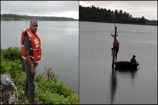 A Lineman repaired Power line amidst Hemavati reservoir waters public appreciation