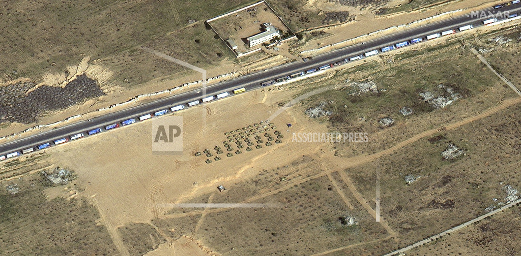 Israeli soldiers move tanks at a staging area near the border with the Gaza Strip, southern Israel