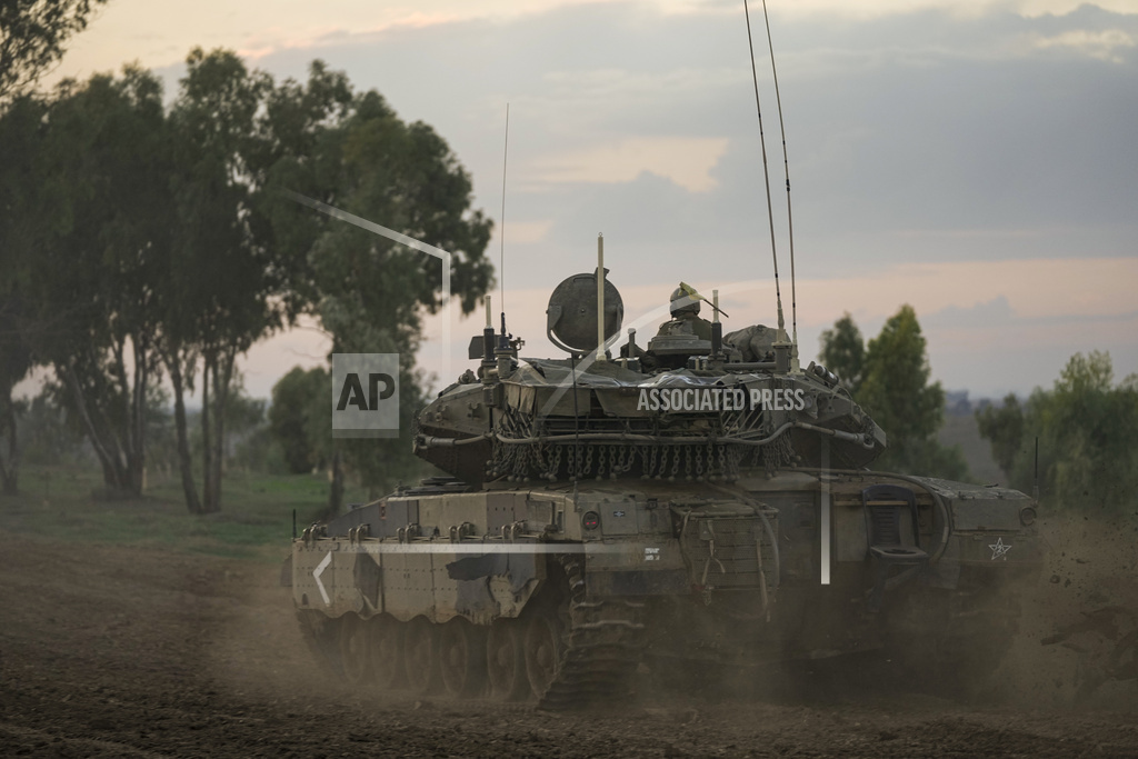 Israeli soldiers move near the border with the Gaza Strip, southern Israel