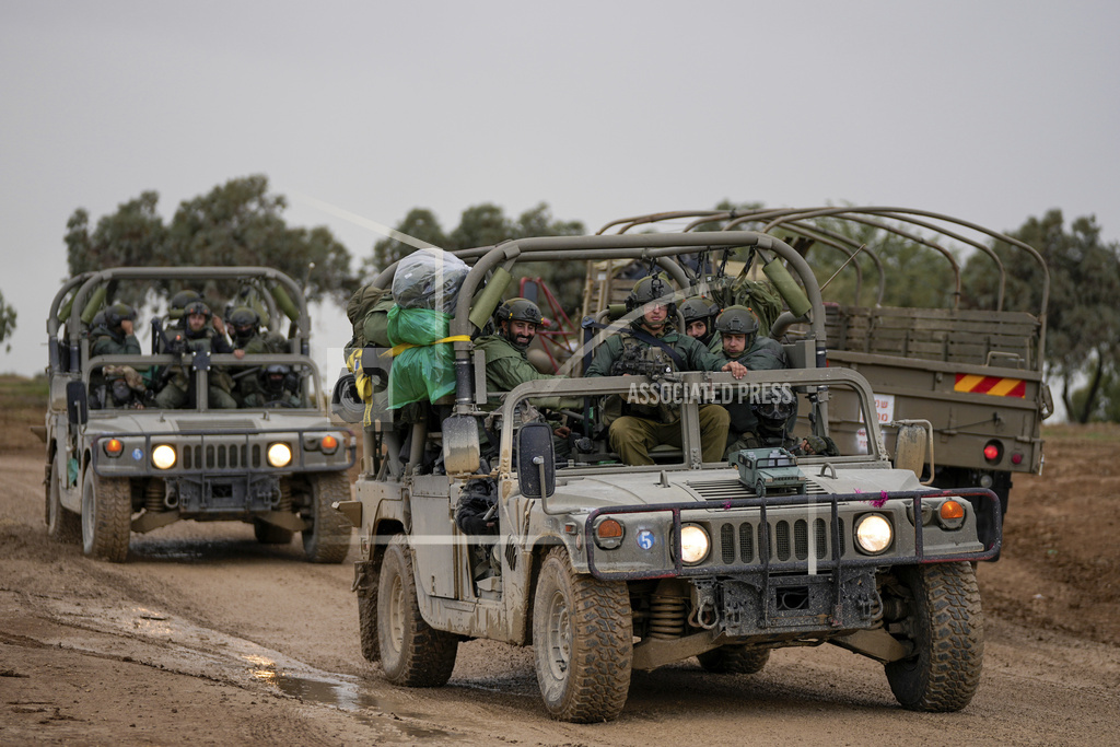 Israeli soldiers move near the border with the Gaza Strip, southern Israel