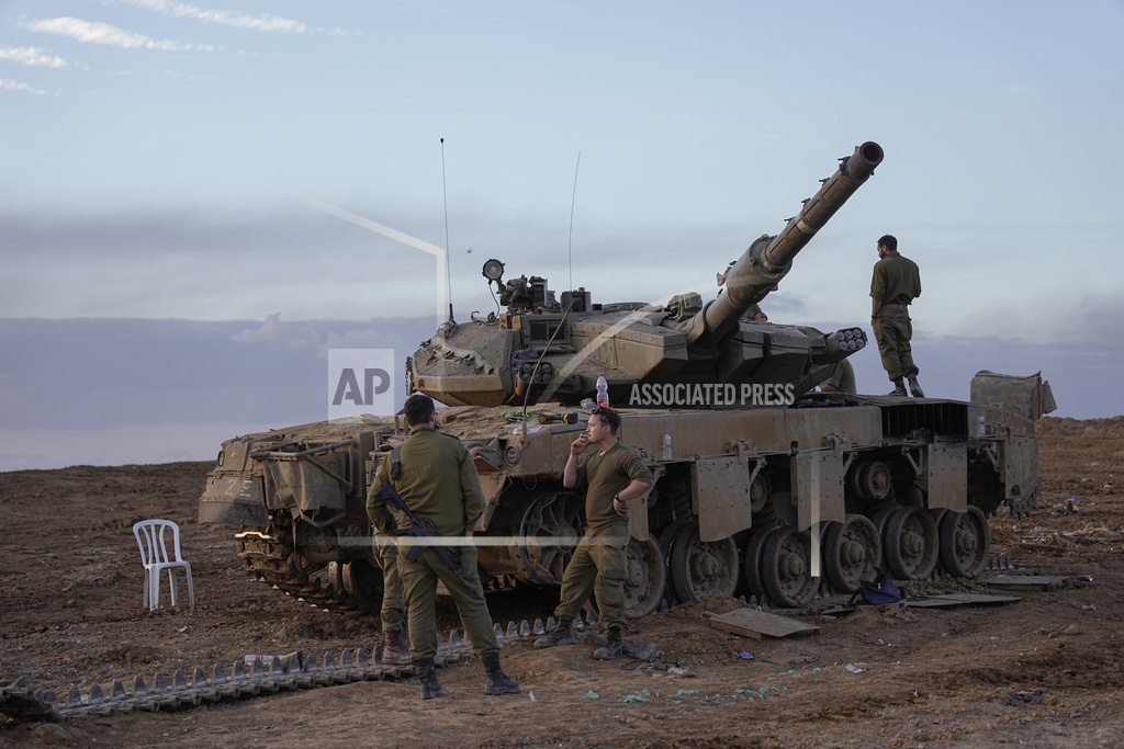 Israeli soldiers move near the border with the Gaza Strip, southern Israel