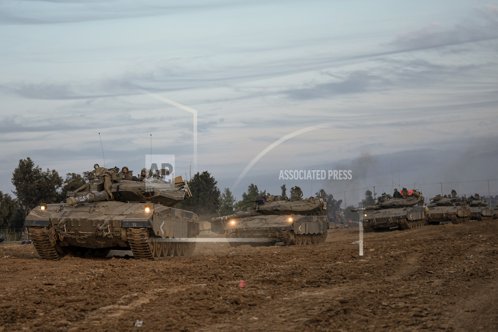 Israeli soldiers move near the border with the Gaza Strip, southern Israel